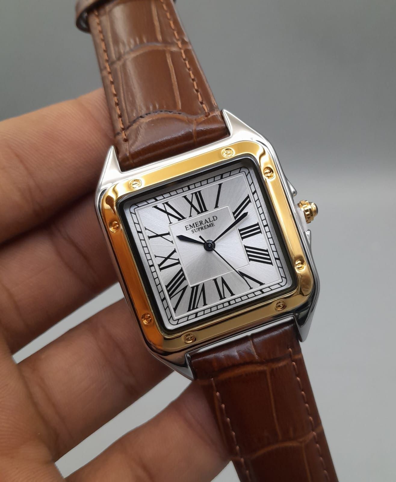 The Emerald Supreme cubex model golden dial watches